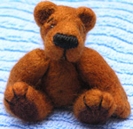 A finished needle felted bear.